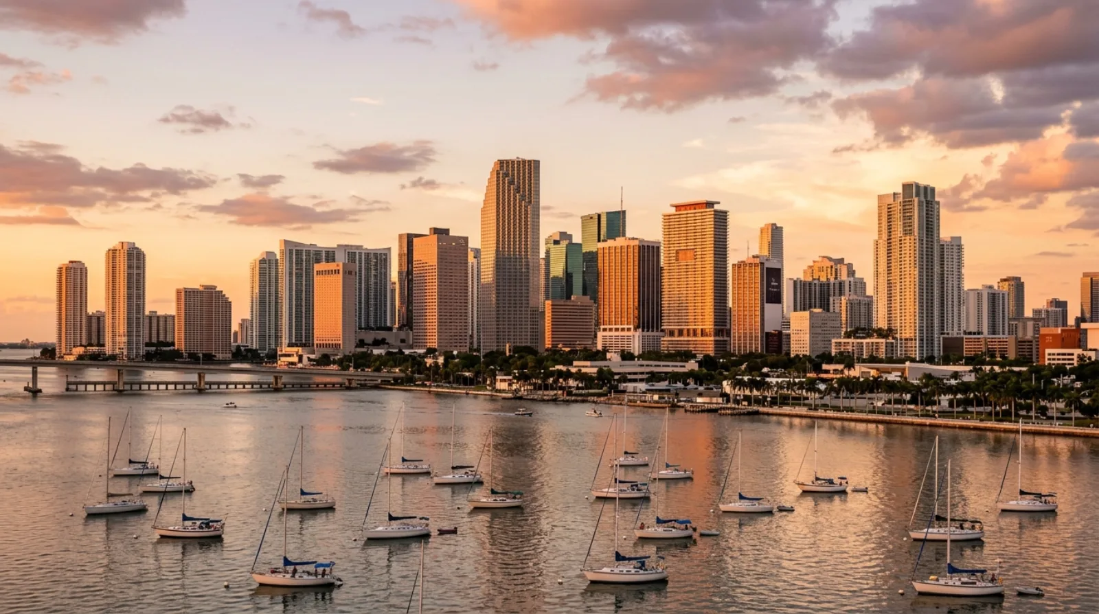 Brickell and downtown Miami skyline across Biscayne Bay at dusk