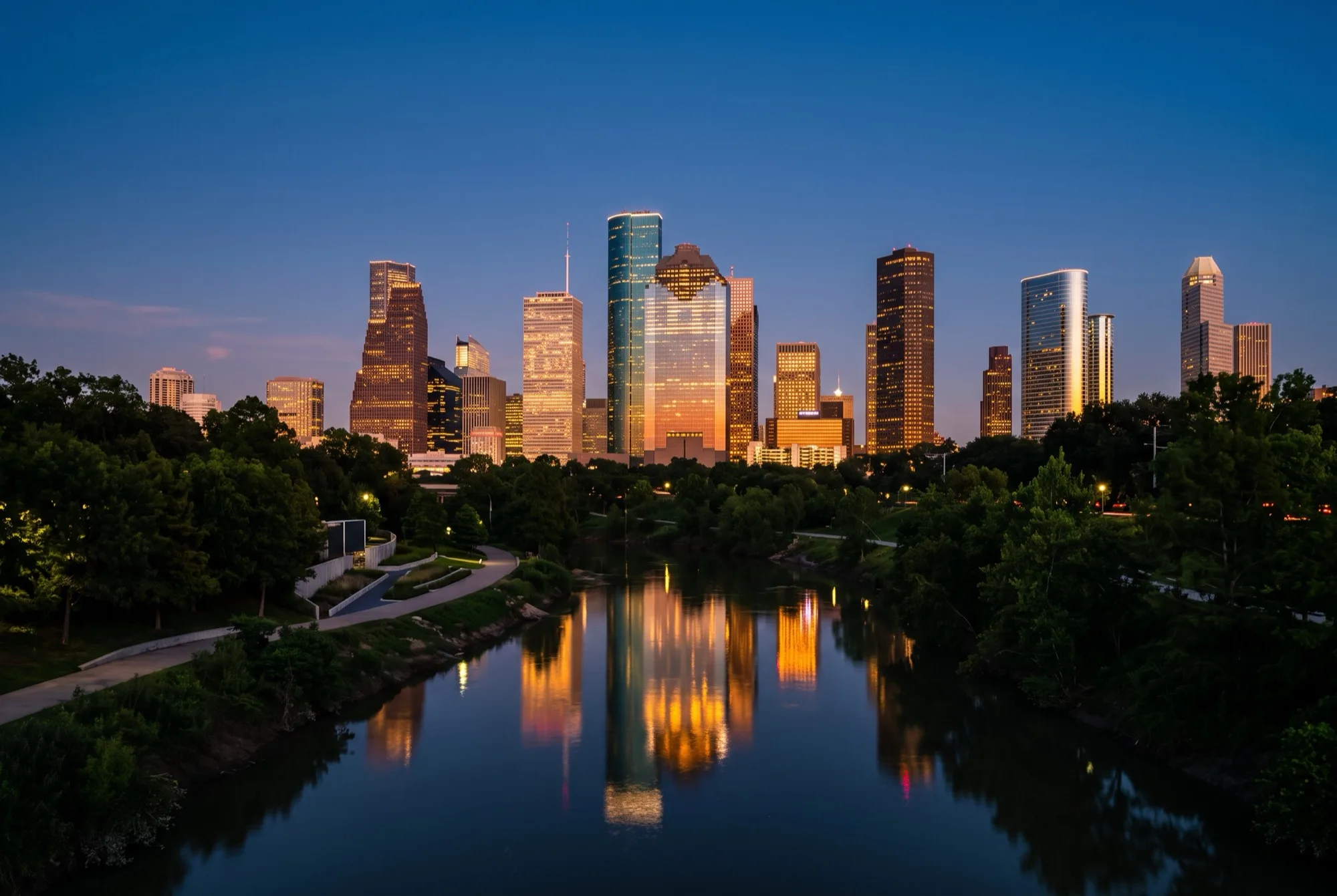 Houston skyline over Buffalo Bayou in Texas at dusk